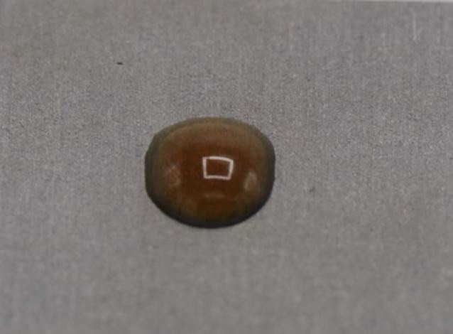Drop of asphaltenes in toluene sliding on a surface